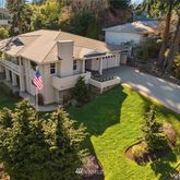 a aerial view of a house with swimming pool and garden