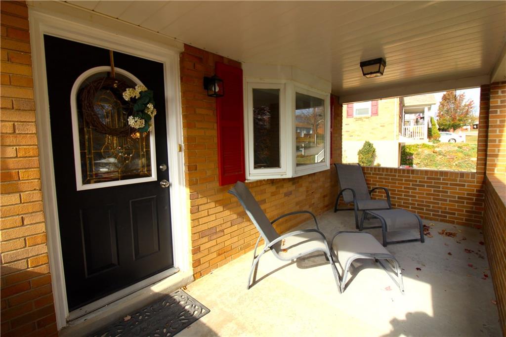 38 Highbury Road Cheswick, PA 15024 - Photo 5 of 47 Large covered front porch over looking park.
