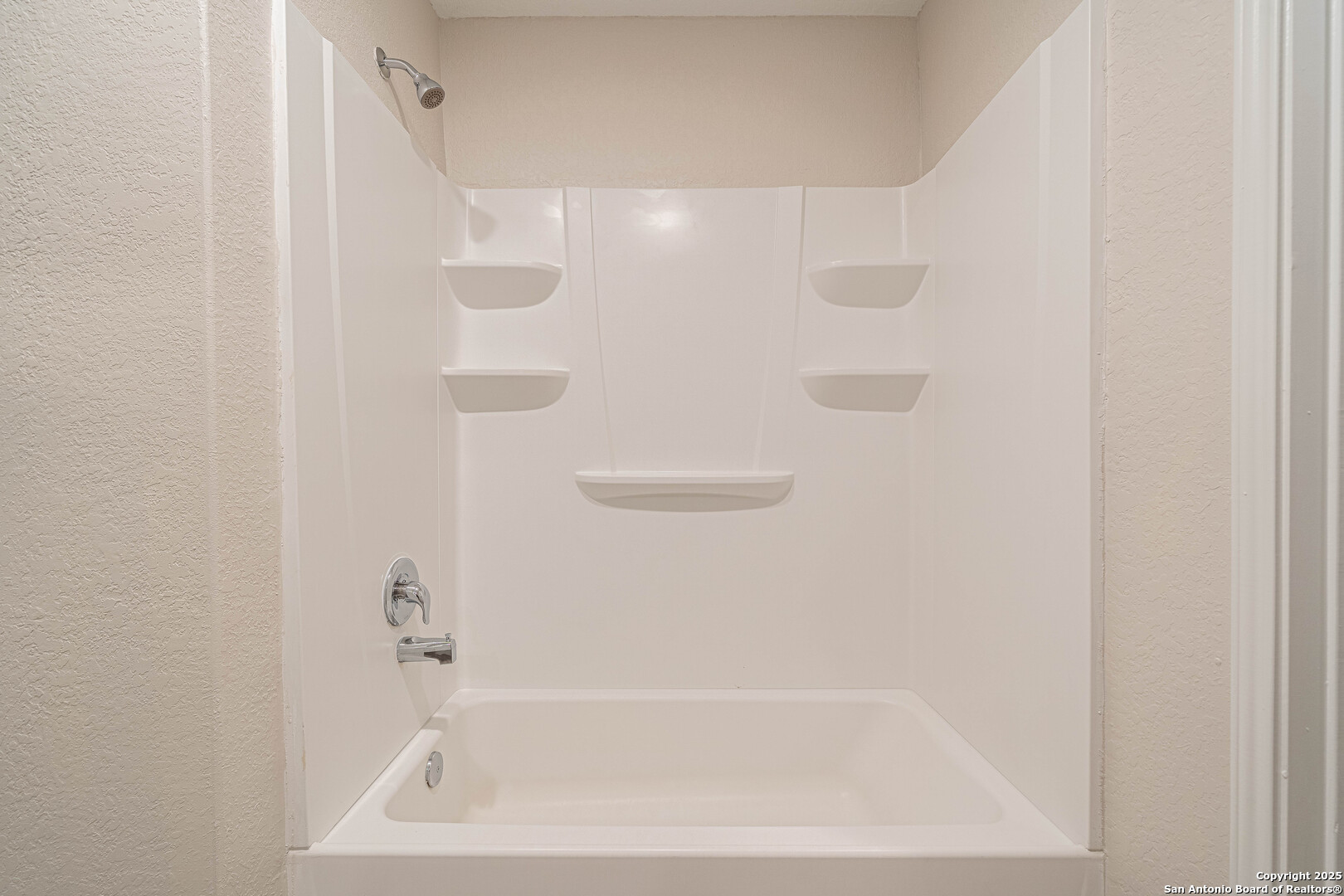 2818 Gustavo Drive Converse, TX 78109 - Photo 15 of 27 a close up of a bathtub in a bathroom