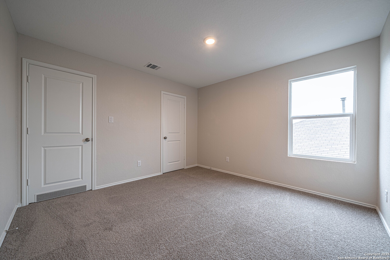 2818 Gustavo Drive Converse, TX 78109 - Photo 19 of 27 an empty room with a window
