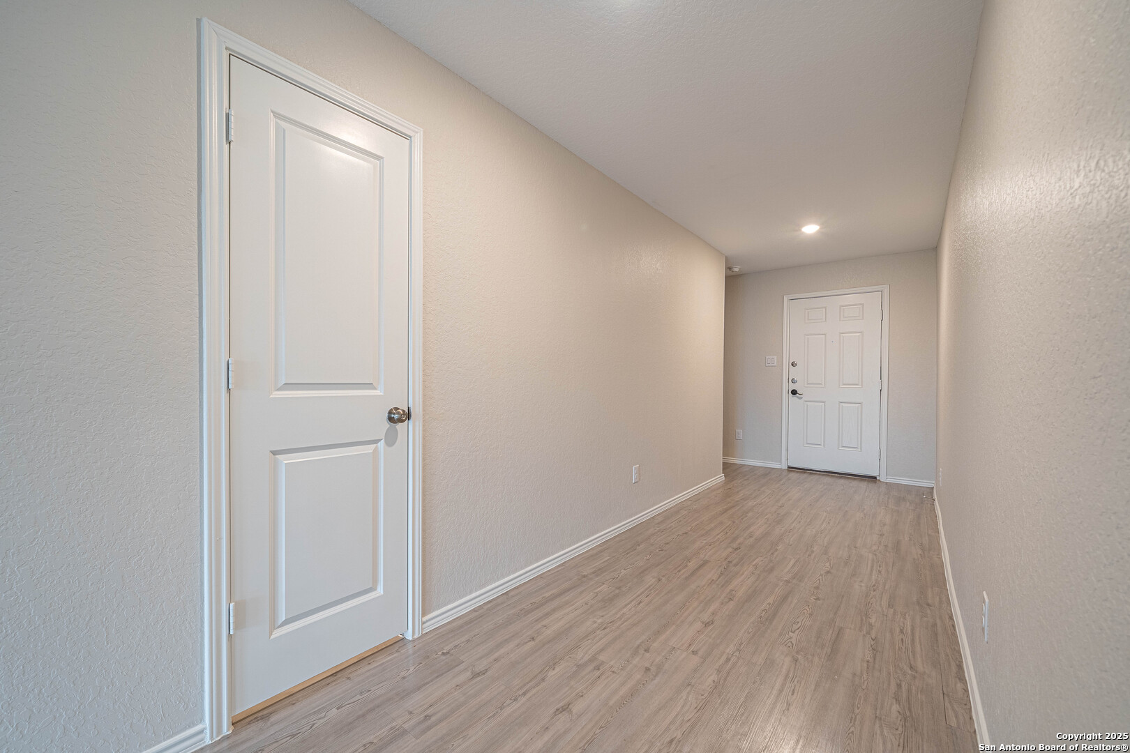 2818 Gustavo Drive Converse, TX 78109 - Photo 2 of 27 a view of an empty room with wooden floor