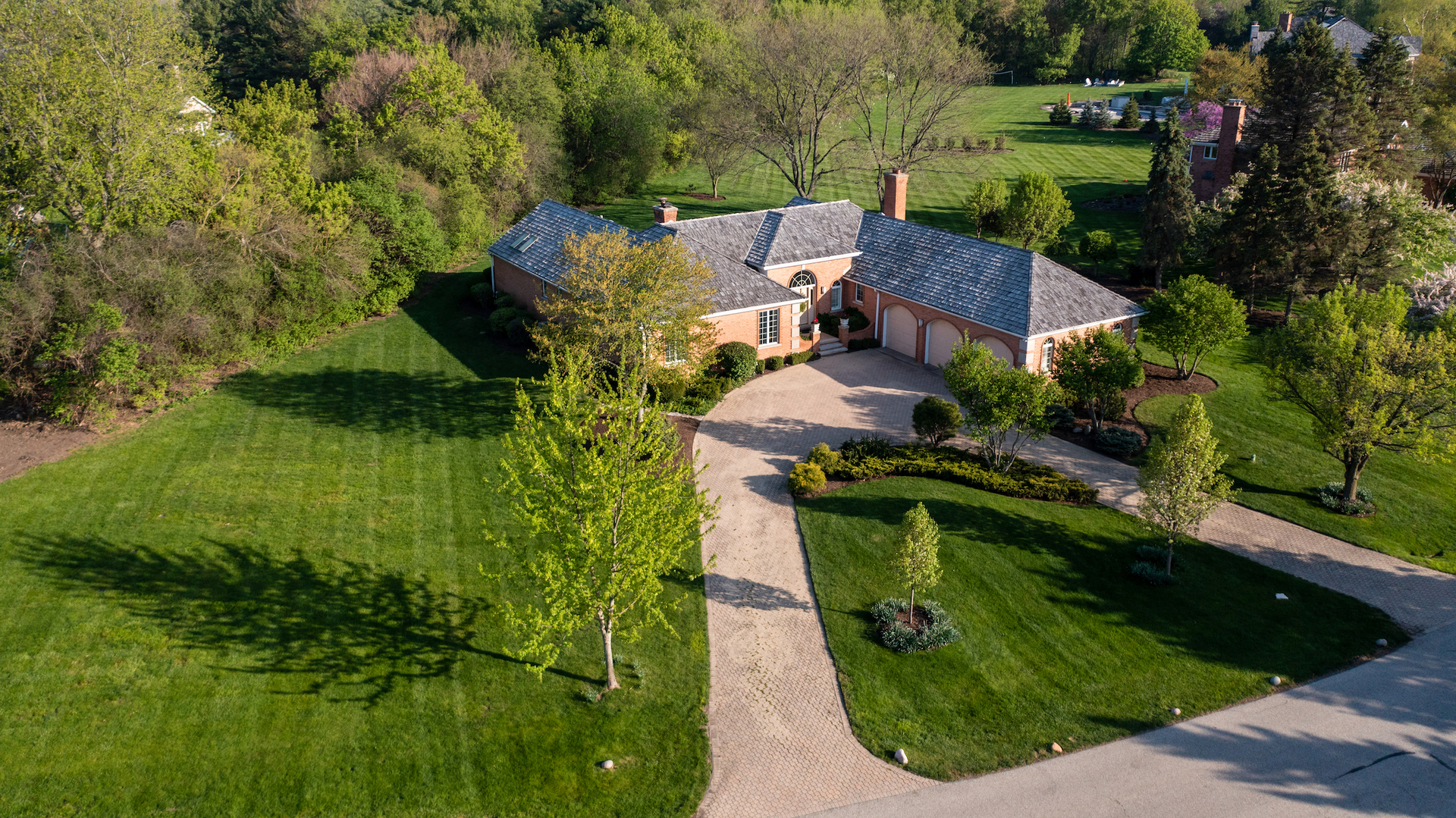 an aerial view of a house with a garden