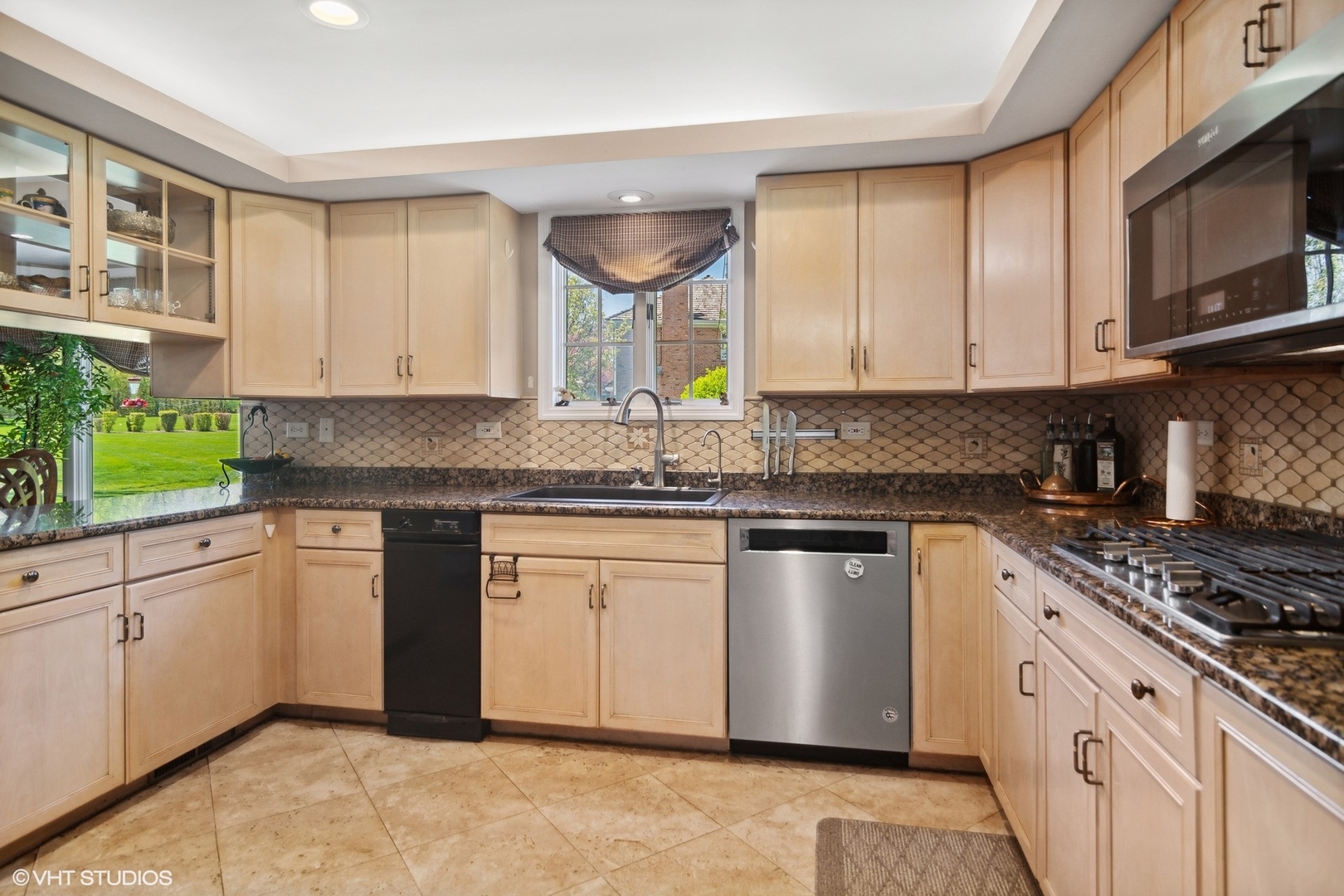 6207 Pine Tree Drive Long Grove, IL 60047 - Photo 15 of 49 a kitchen with granite countertop cabinets stainless steel appliances a sink and a window