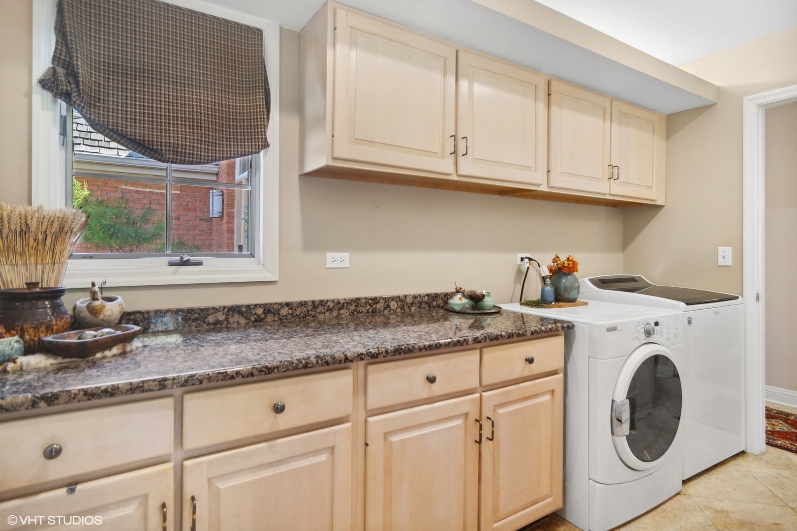 6207 Pine Tree Drive Long Grove, IL 60047 - Photo 18 of 49 a kitchen with granite countertop white cabinets and a sink