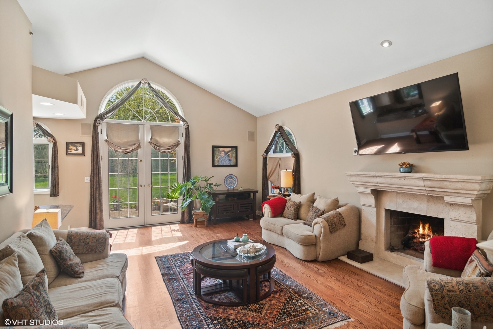 6207 Pine Tree Drive Long Grove, IL 60047 - Photo 19 of 49 a living room with furniture a large window and a flat screen tv