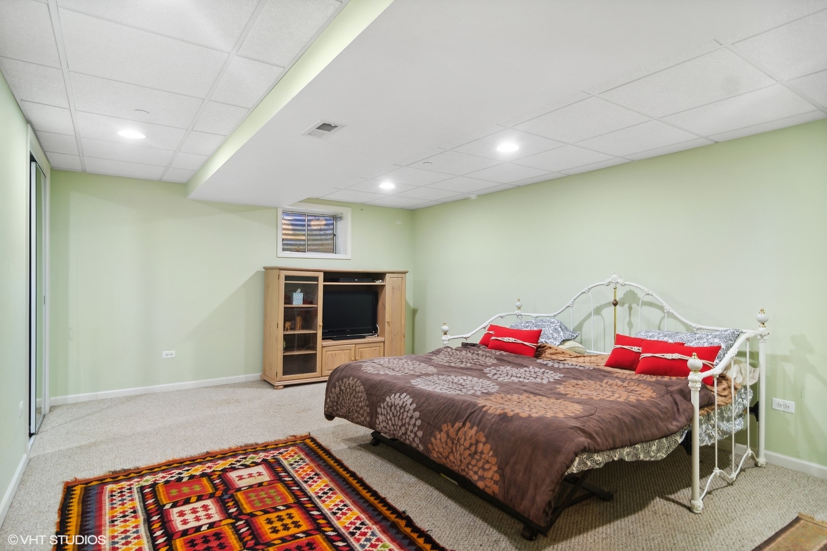 6207 Pine Tree Drive Long Grove, IL 60047 - Photo 30 of 49 a bedroom with a bed and a television