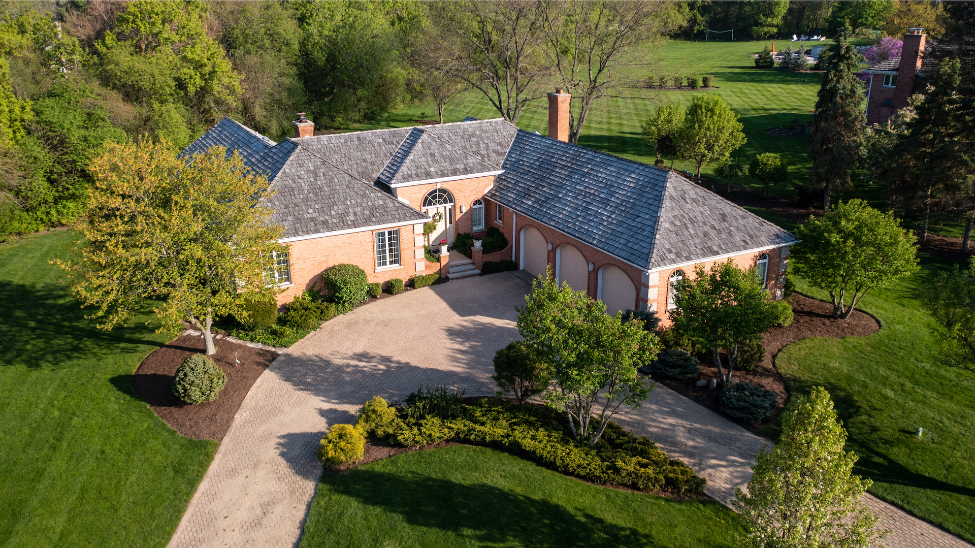 6207 Pine Tree Drive Long Grove, IL 60047 - Photo 3 of 49 a view of a house with garden and yard