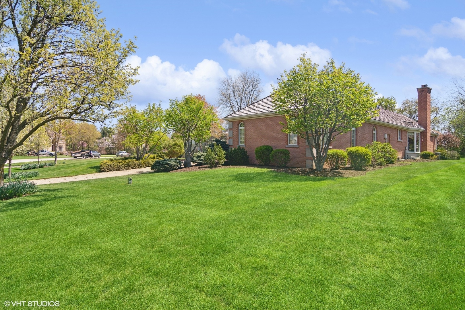 6207 Pine Tree Drive Long Grove, IL 60047 - Photo 42 of 49 a view of a garden with a house in the background