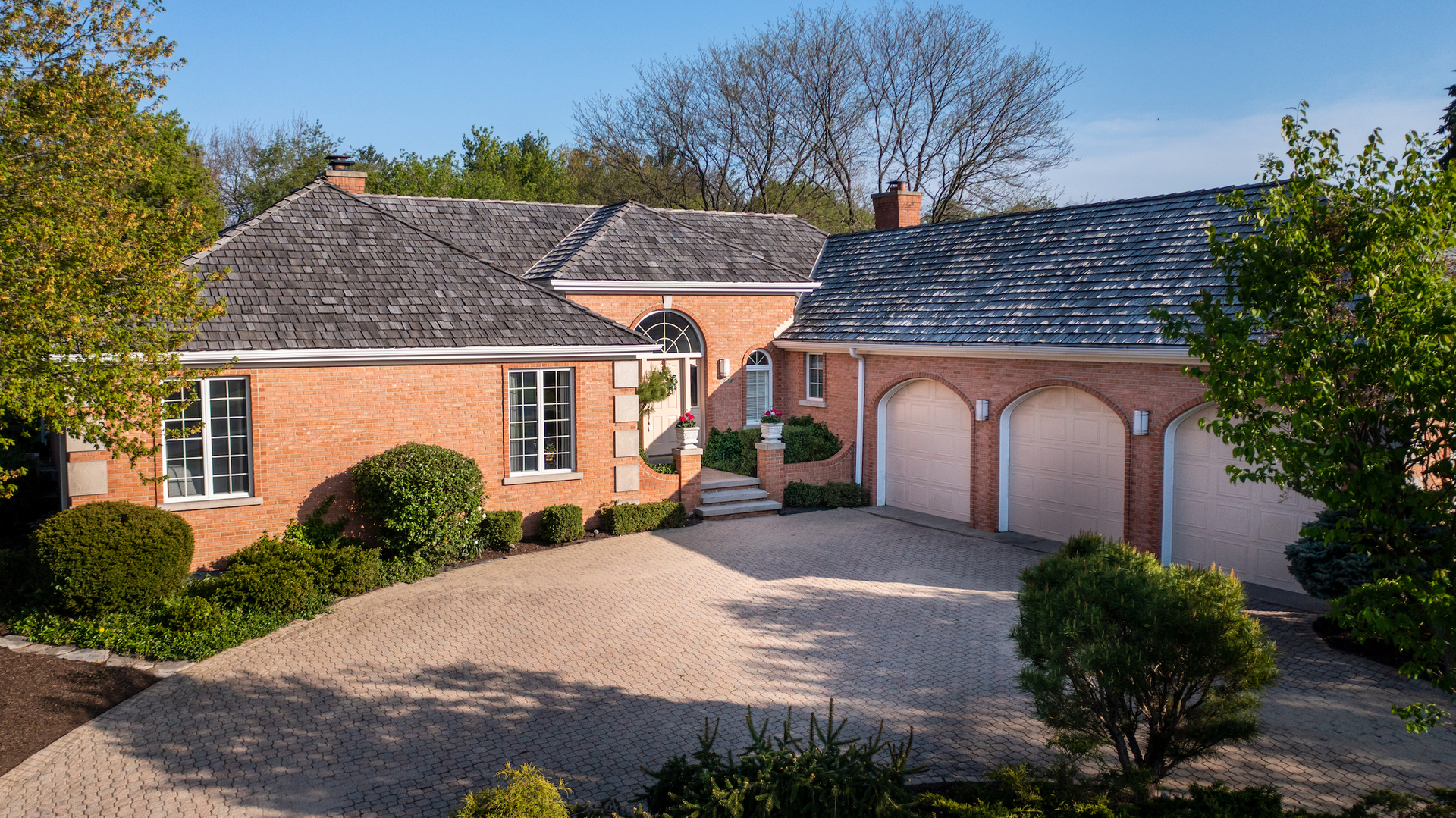 6207 Pine Tree Drive Long Grove, IL 60047 - Photo 48 of 49 a front view of a house with garden and plants