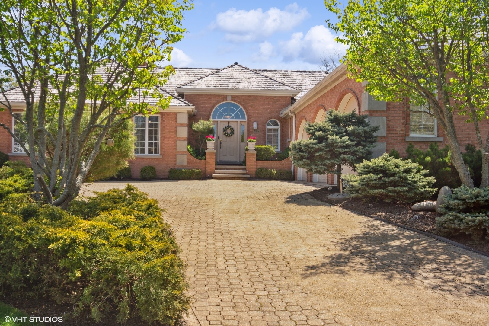 6207 Pine Tree Drive Long Grove, IL 60047 - Photo 5 of 49 a front view of a house with a yard