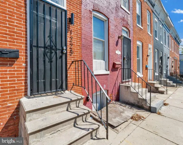 a view of a brick building with many windows