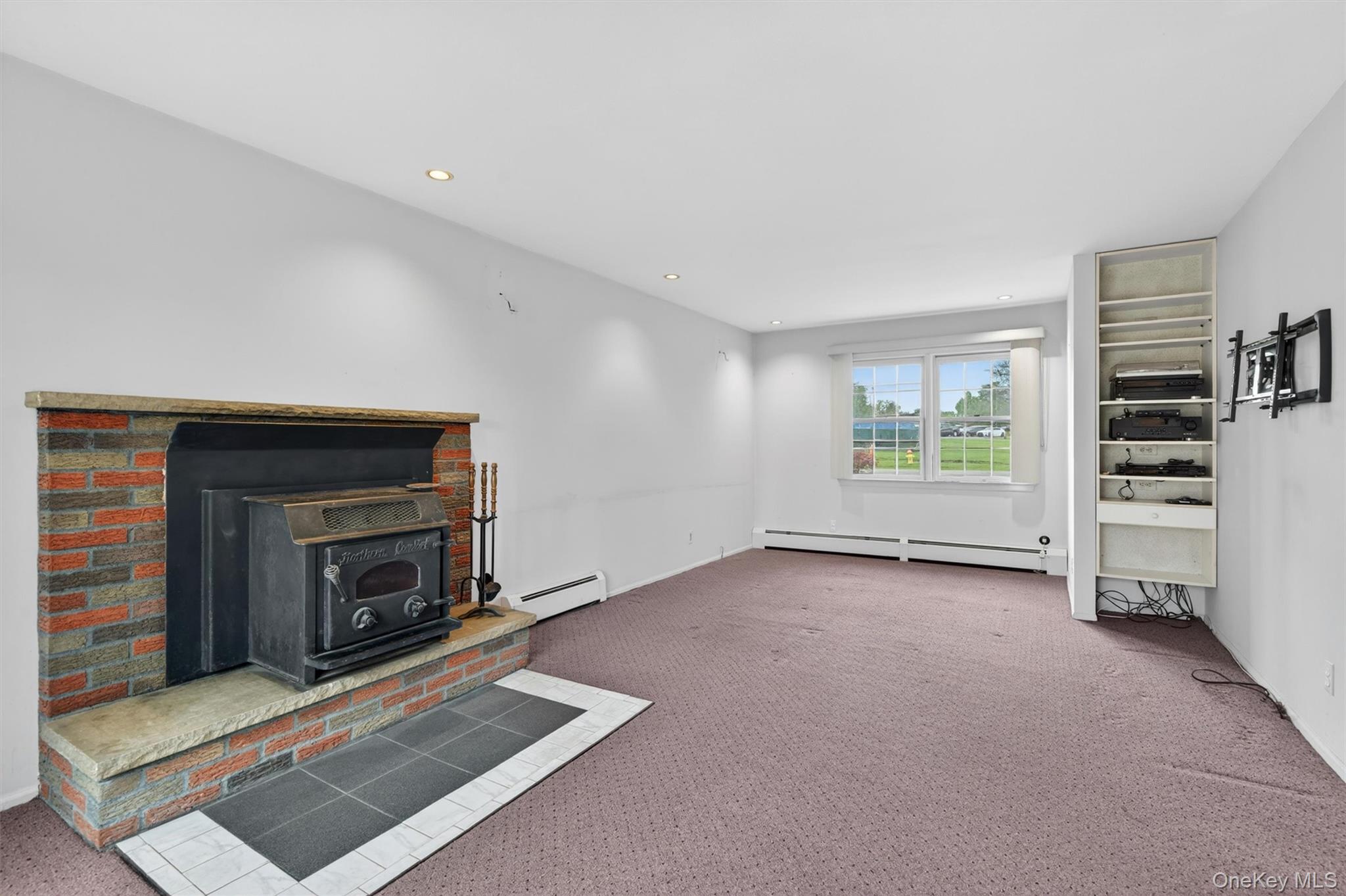155 Pine Tree Road Monroe, NY 10950 - Photo 17 of 49 a view of a livingroom with a fireplace and window