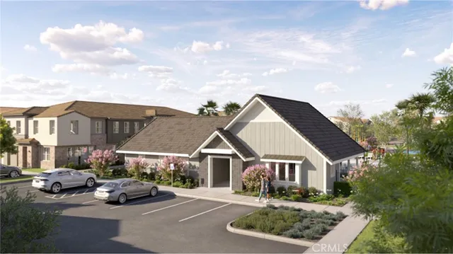 a front view of multiple houses with small garden