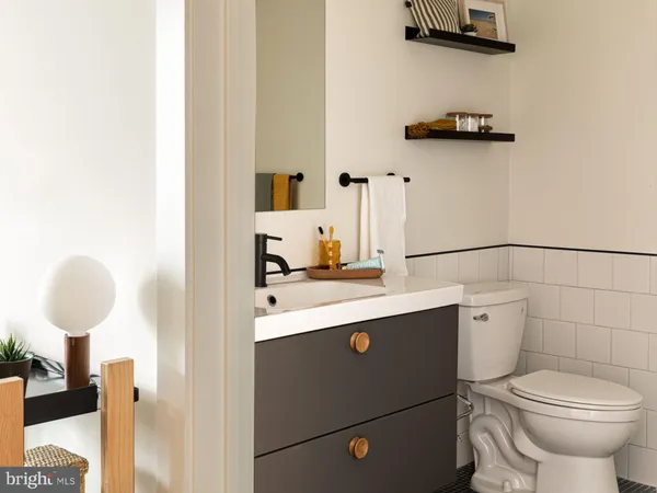 a bathroom with a toilet and a sink