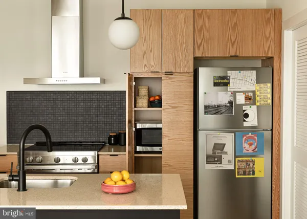a kitchen with a sink and a refrigerator
