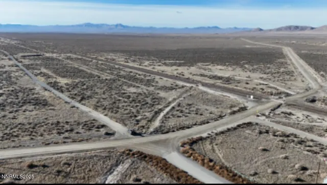 a view of an ocean beach and mountain