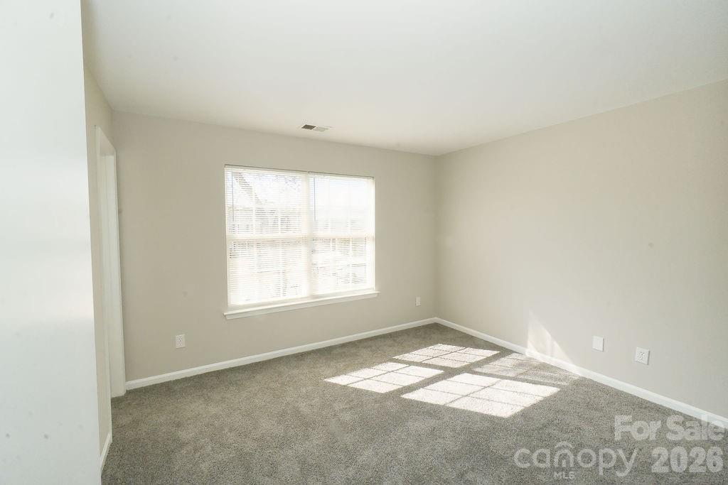 9614 Rau Court Charlotte, NC 28215 - Photo 11 of 21 an empty room with a window