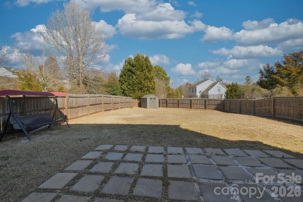 9614 Rau Court Charlotte, NC 28215 - Photo 18 of 21 a view of backyard with large trees