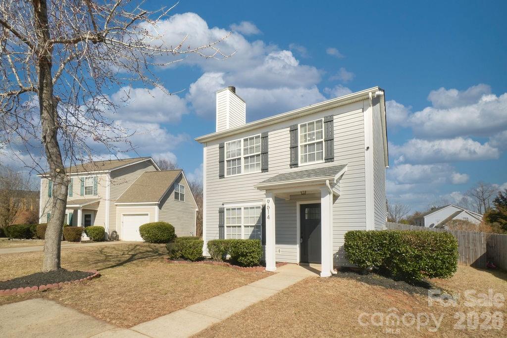 9614 Rau Court Charlotte, NC 28215 - Photo 2 of 21 a view of a house with a yard