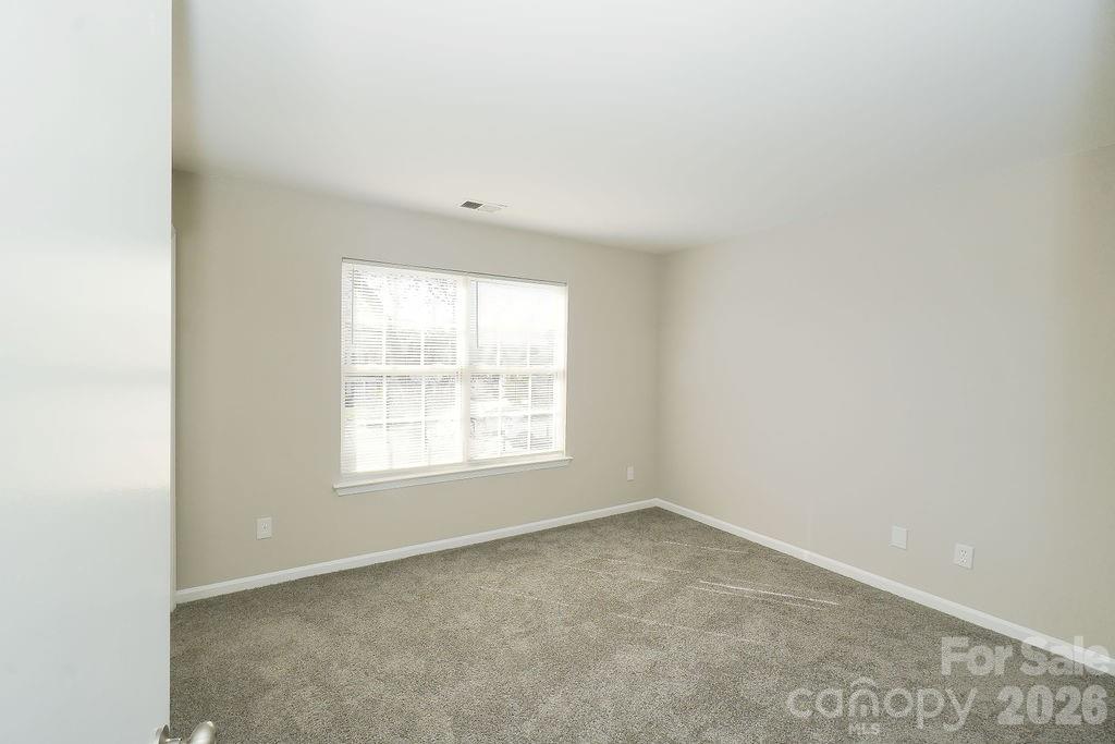 9614 Rau Court Charlotte, NC 28215 - Photo 7 of 21 an empty room with a window