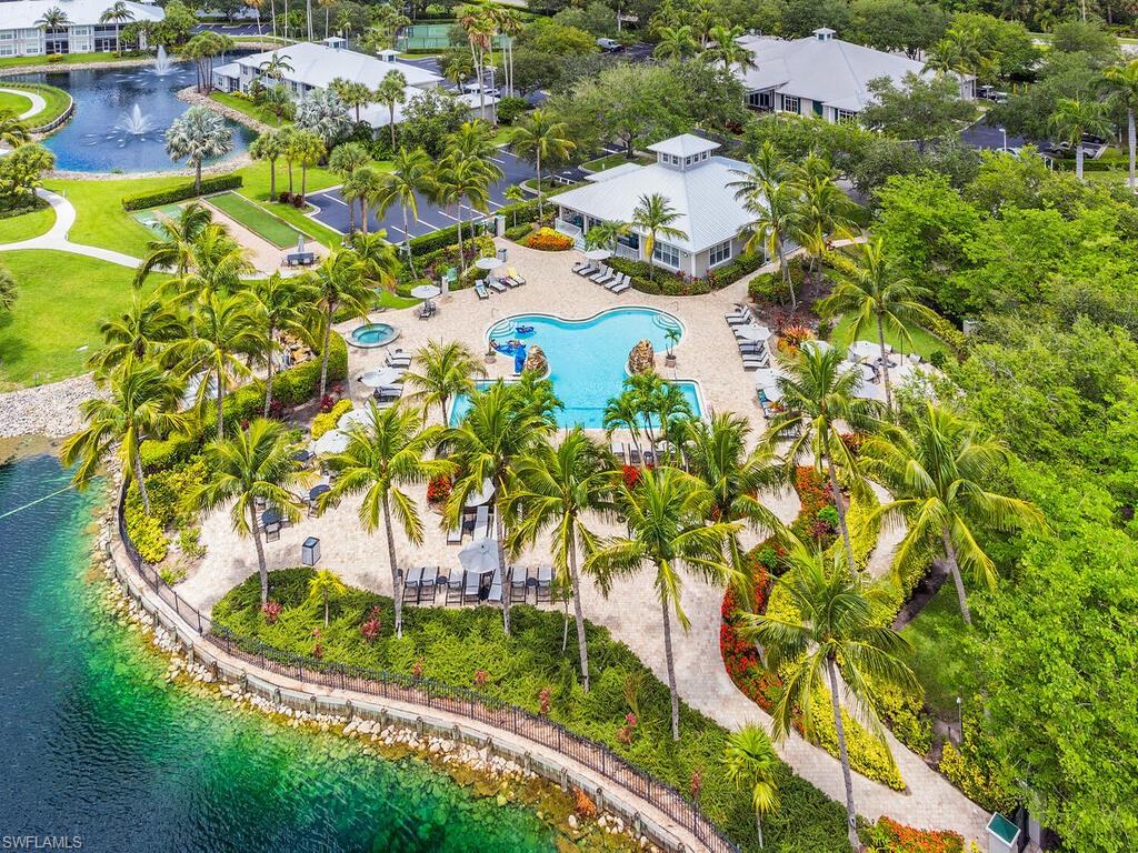 7970 Mahogany Run Lane, Unit 216 Naples, FL 34113 - Photo 16 of 29 a view of a lake with a building in the background