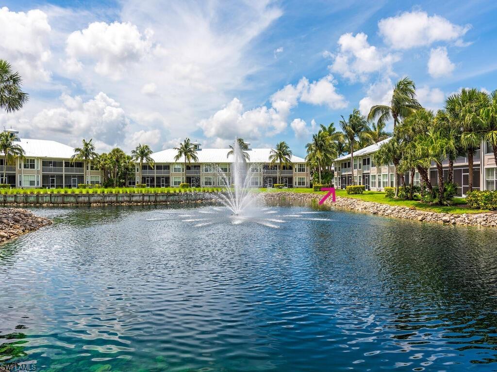 7970 Mahogany Run Lane, Unit 216 Naples, FL 34113 - Photo 19 of 29 a view of a lake with houses