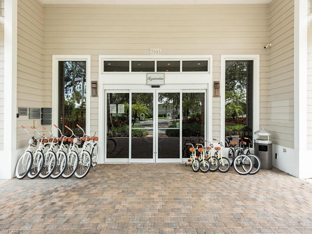 7970 Mahogany Run Lane, Unit 216 Naples, FL 34113 - Photo 22 of 29 a view of a chairs and table in patio