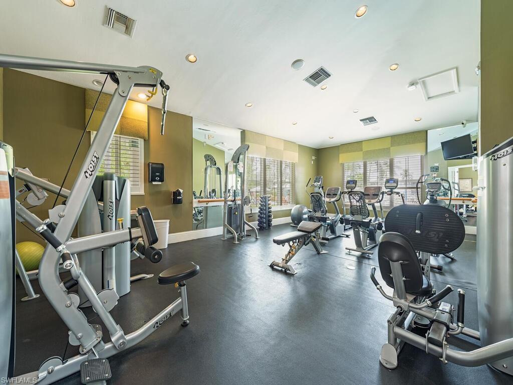 7970 Mahogany Run Lane, Unit 216 Naples, FL 34113 - Photo 25 of 29 a view of a room with gym equipment