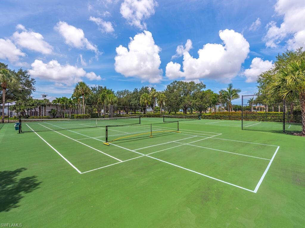7970 Mahogany Run Lane, Unit 216 Naples, FL 34113 - Photo 27 of 29 a view of a tennis court