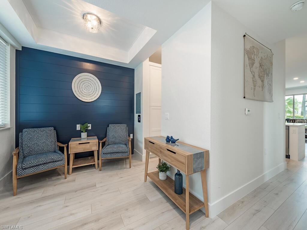 7970 Mahogany Run Lane, Unit 216 Naples, FL 34113 - Photo 3 of 29 a living room with furniture and a window