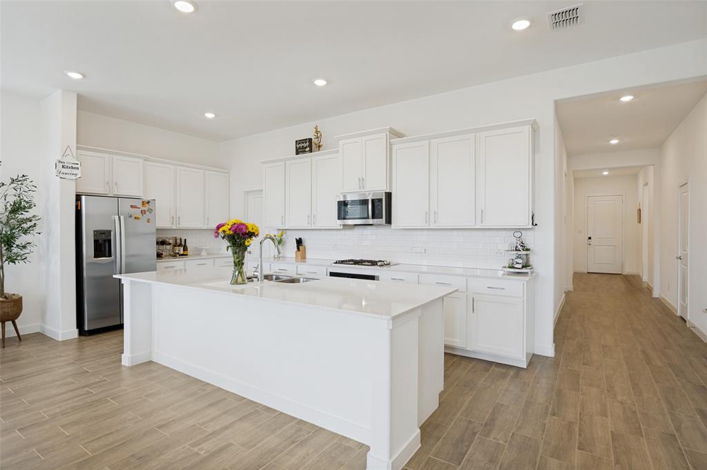 536 Breeds Hl Road Little Elm, TX 75068 - Photo 3 of 13 Gourmet quartz kitchen (Refridgerator included), Seperate Dining Area close to kitchen.