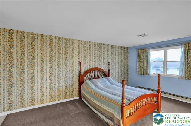 a bed room with a bed and a window