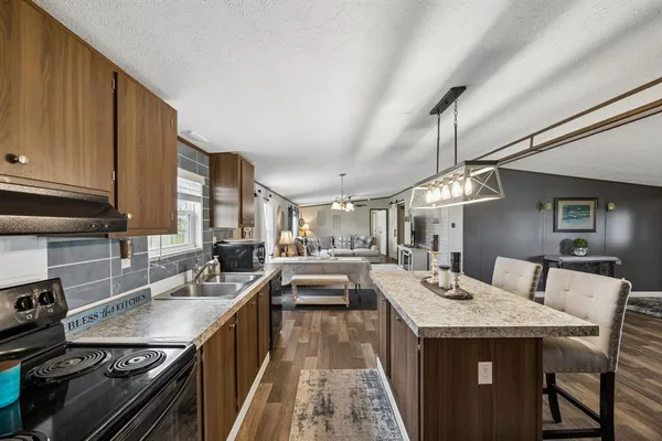 a kitchen with a stove and a sink