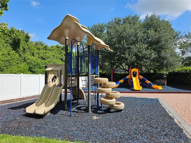 a view of a park with slide and a slide