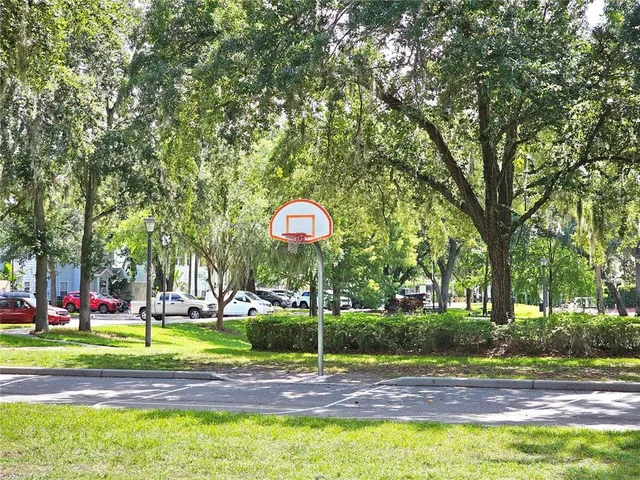 a view of a playground with basketball court
