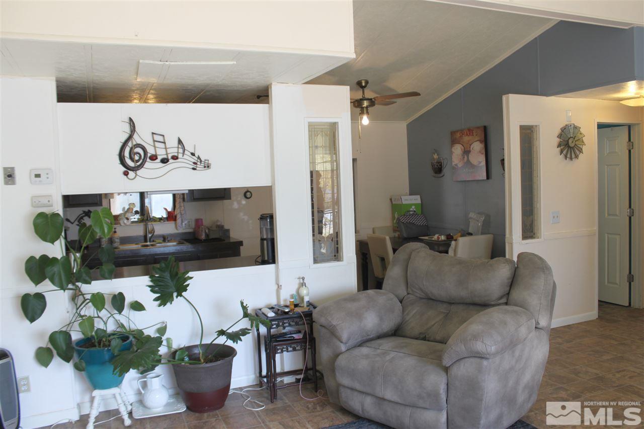 17645 Macaw Lane Reno, NV 89508 - Photo 3 of 19 a living room with furniture and painting on the wall