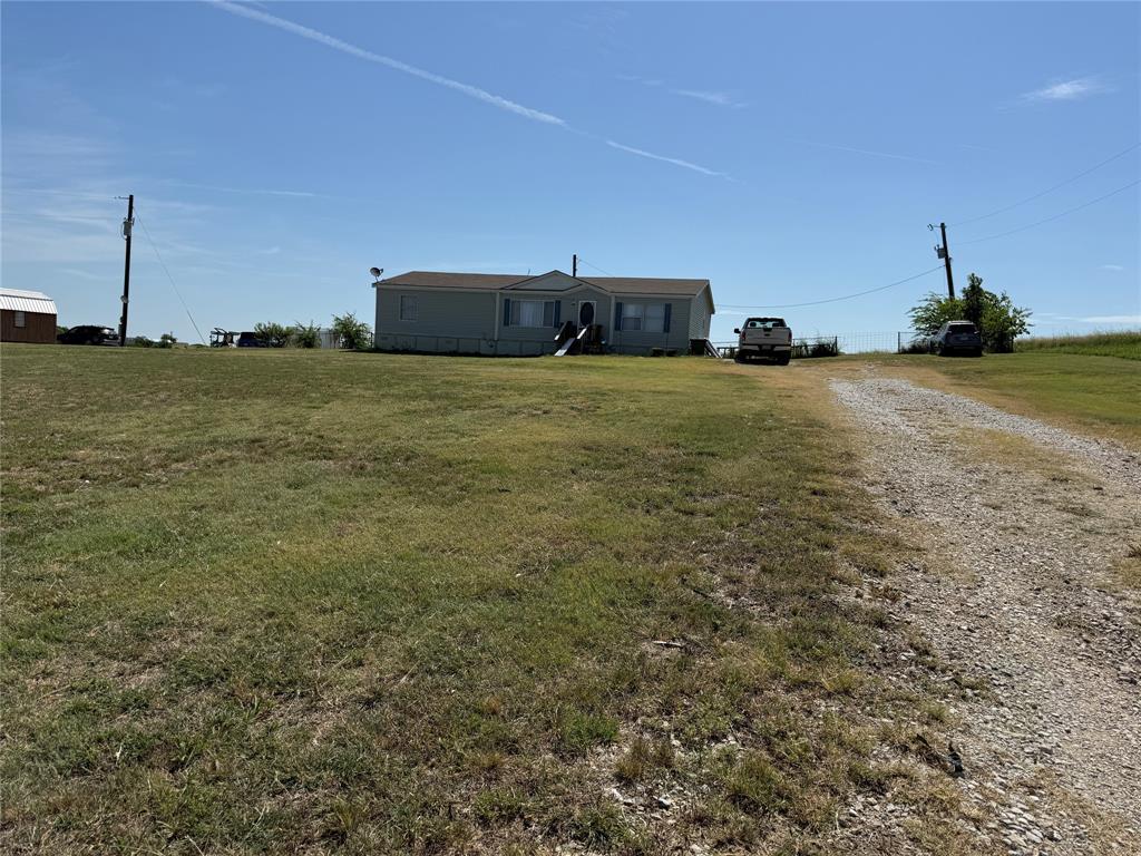 451 Coyote Trail Rhome, TX 76078 - Photo 2 of 11 Gravel drive