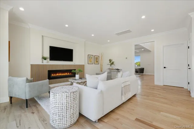 a kitchen with kitchen island white cabinets and white appliances