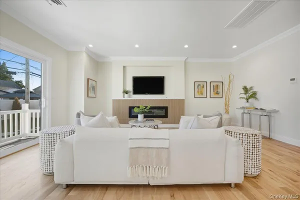 a large white kitchen with cabinets