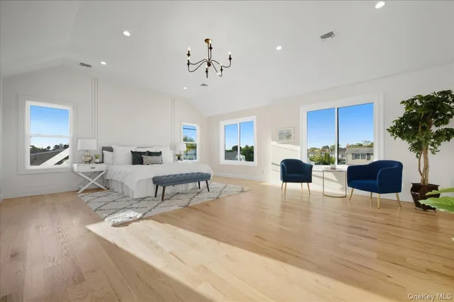 a bathroom with a shower a sink a toilet and a mirror