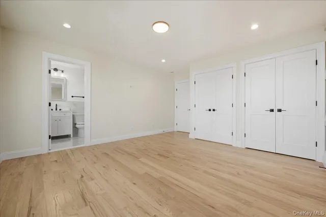 a white bath tub sitting next to a bathroom