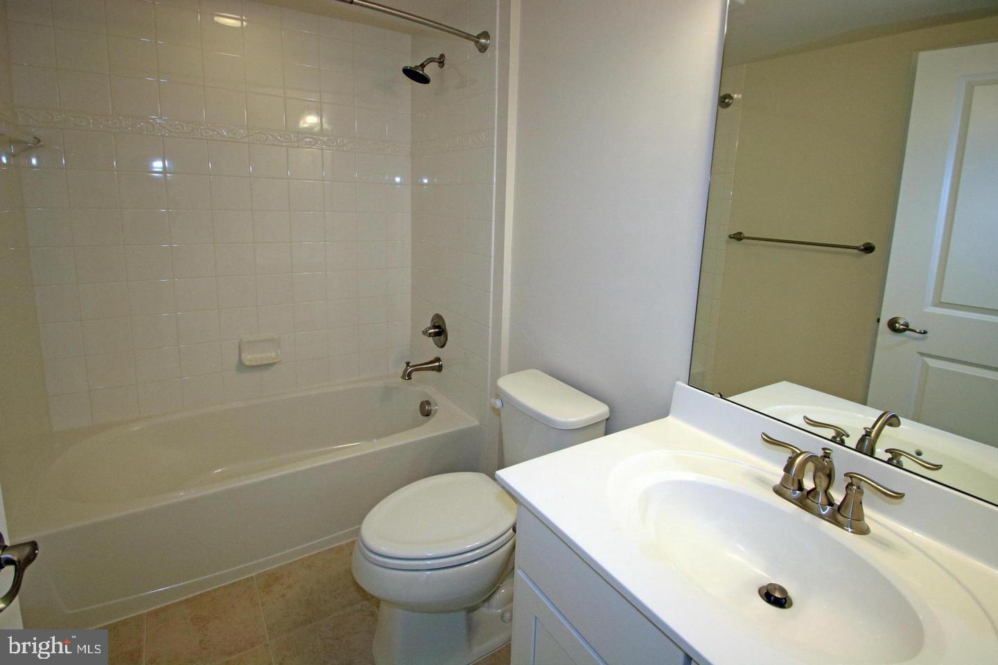 2482 Baldwin Crescent Northeast Washington, DC 20018 - Photo 23 of 28 a bathroom with a sink toilet and shower