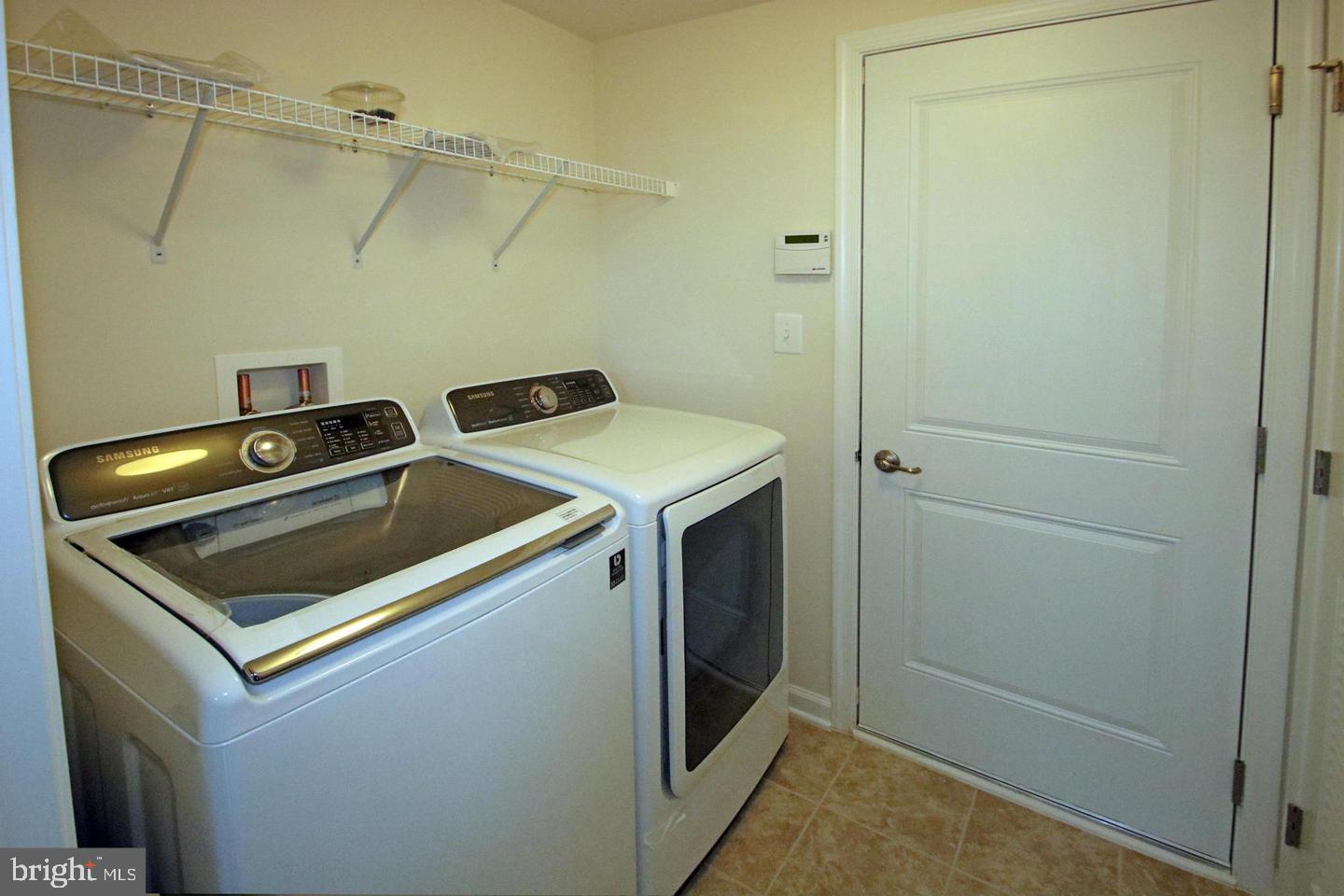 2482 Baldwin Crescent Northeast Washington, DC 20018 - Photo 27 of 28 a utility room with dryer and washer