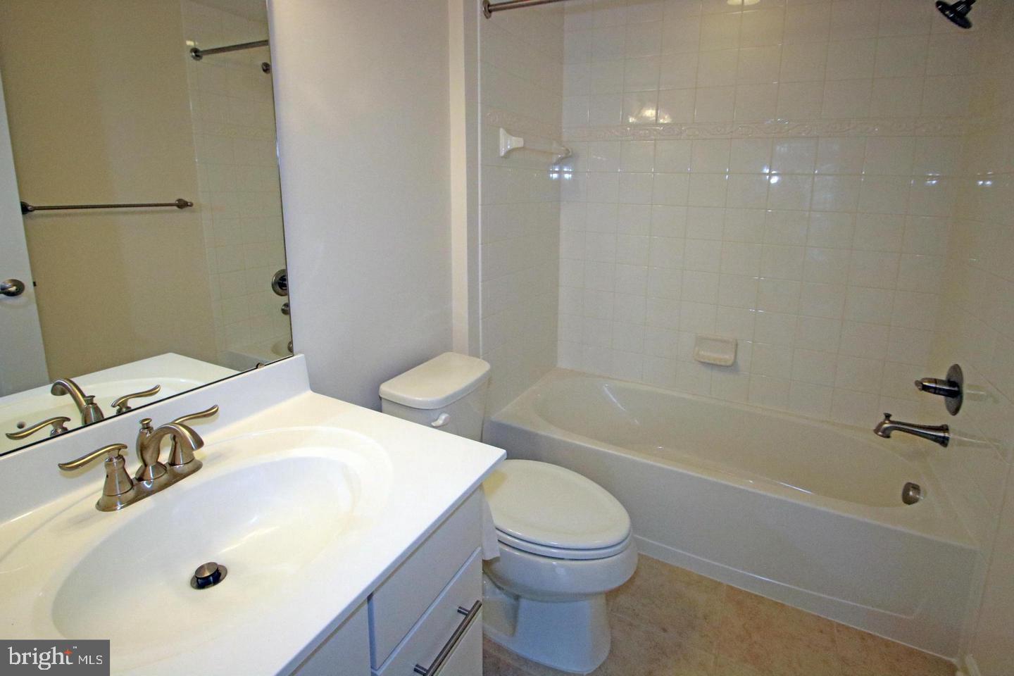 2482 Baldwin Crescent Northeast Washington, DC 20018 - Photo 5 of 28 a bathroom with a sink a toilet and shower