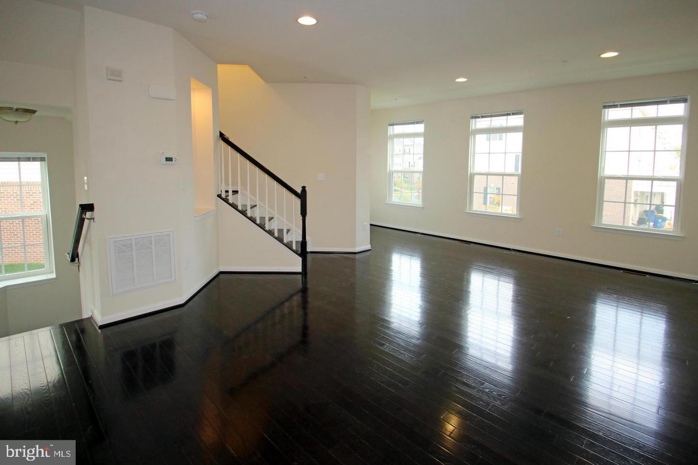 2482 Baldwin Crescent Northeast Washington, DC 20018 - Photo 6 of 28 a view of an entryway with wooden floor and stairs