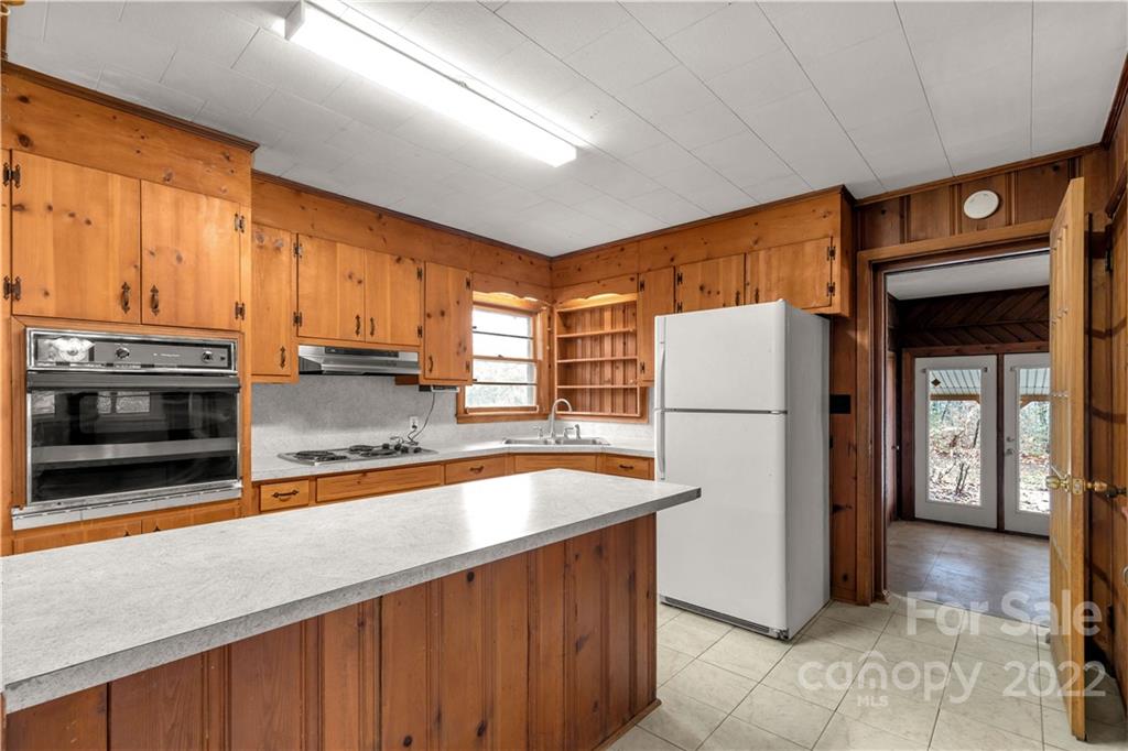 3169 Pink Plyler Road Lancaster, SC 29720 - Photo 14 of 39 a kitchen with stainless steel appliances granite countertop a refrigerator a stove a sink and a microwave