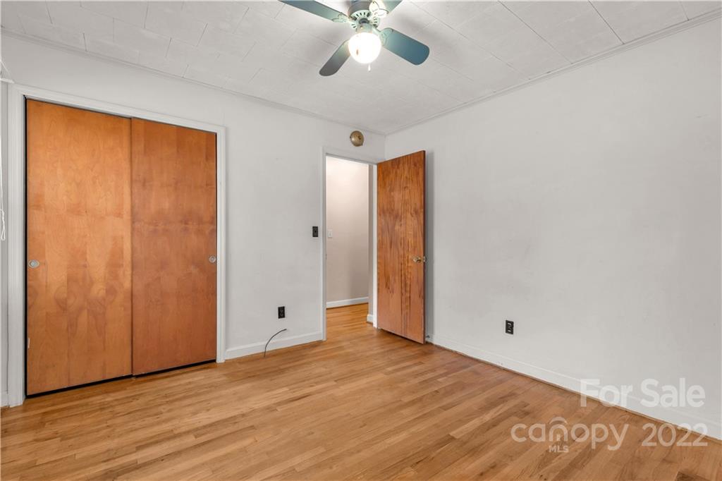 3169 Pink Plyler Road Lancaster, SC 29720 - Photo 18 of 39 a view of an empty room with window and wooden floor