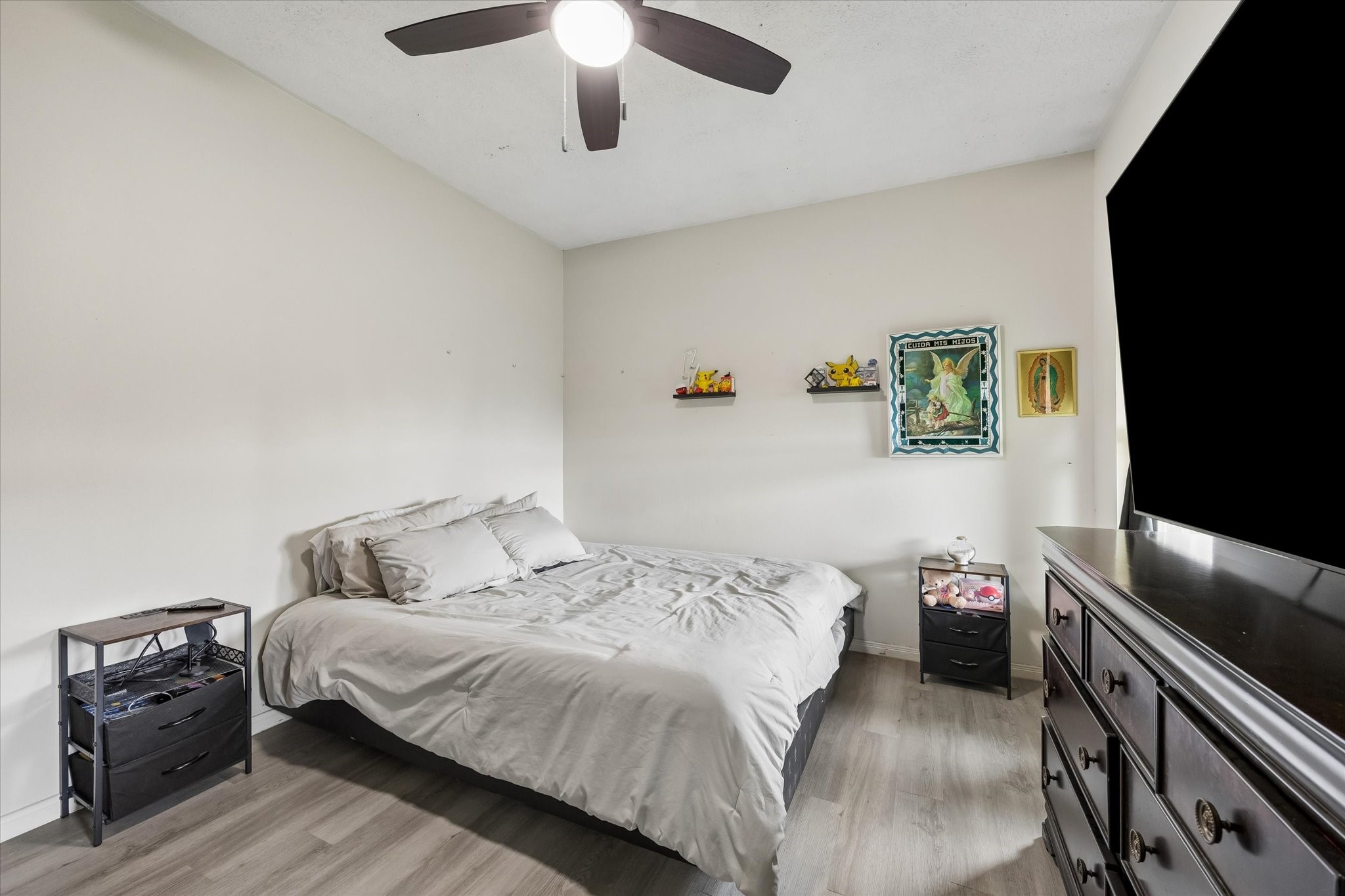 1741 Eagle Lake Road Sealy, TX 77474 - Photo 7 of 15 a bedroom with a bed and a flat tv screen on a dresser
