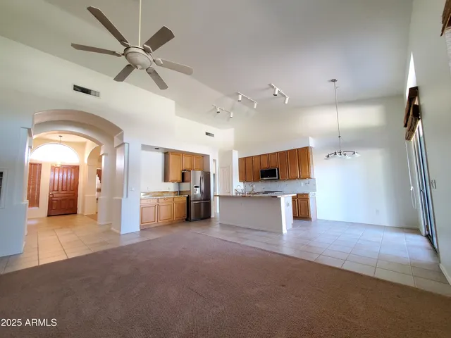 a bathroom with a sink mirror vanity and toilet