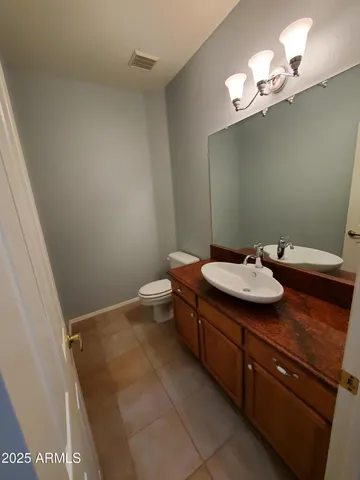 a view of a hallway to rooms